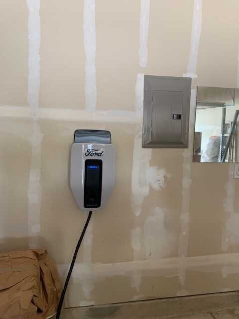 Ford EV home charger installed next to the electrical panel in a San Antonio garage